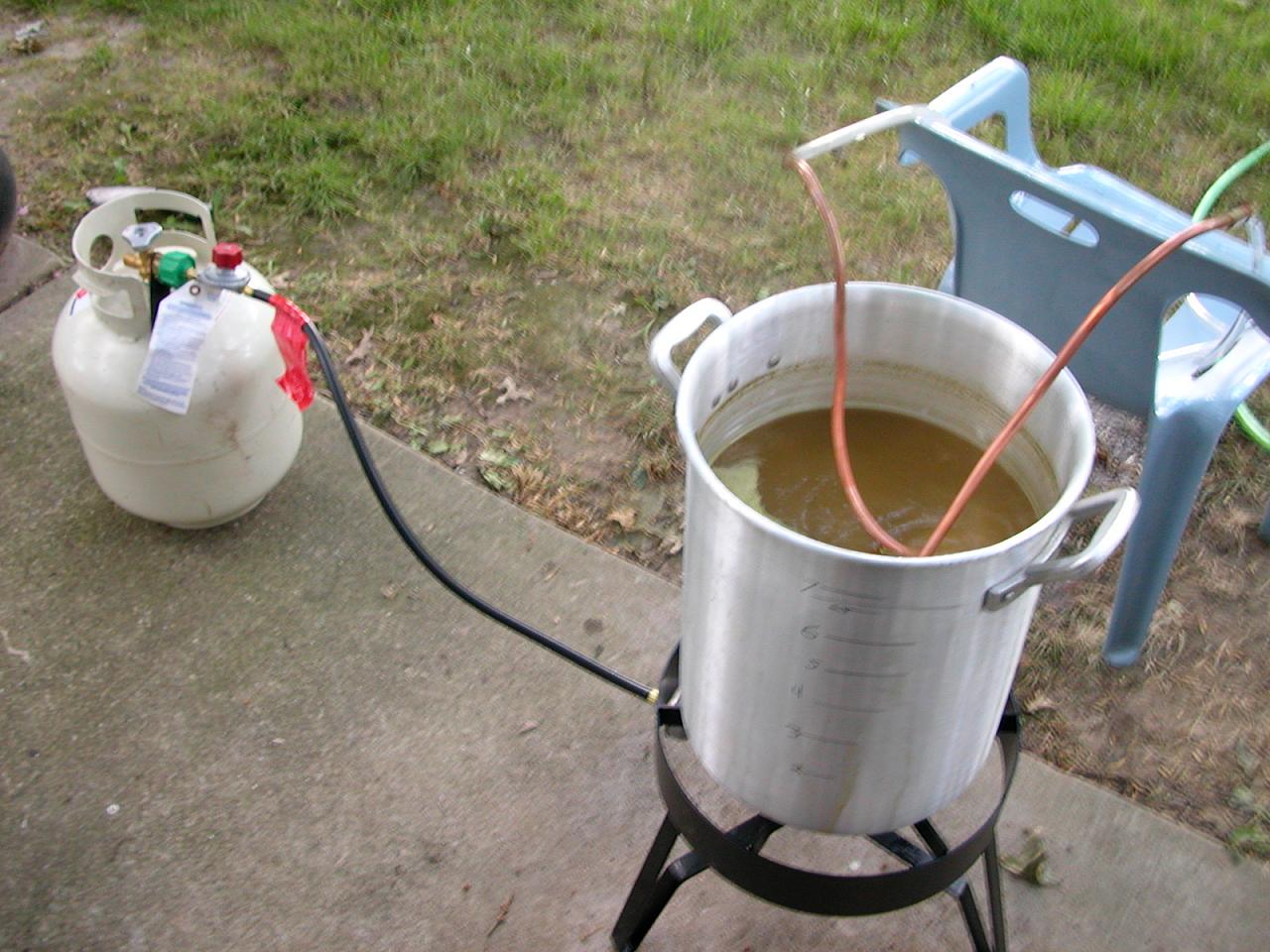 Copper immersion chiller hooked to the garden hose to cool the wort quickly.