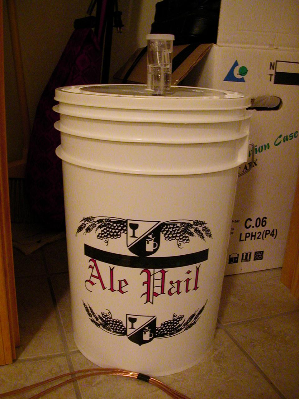 The primary fermentation bucket sitting in my closet with 5 gallons of wort becoming beer.