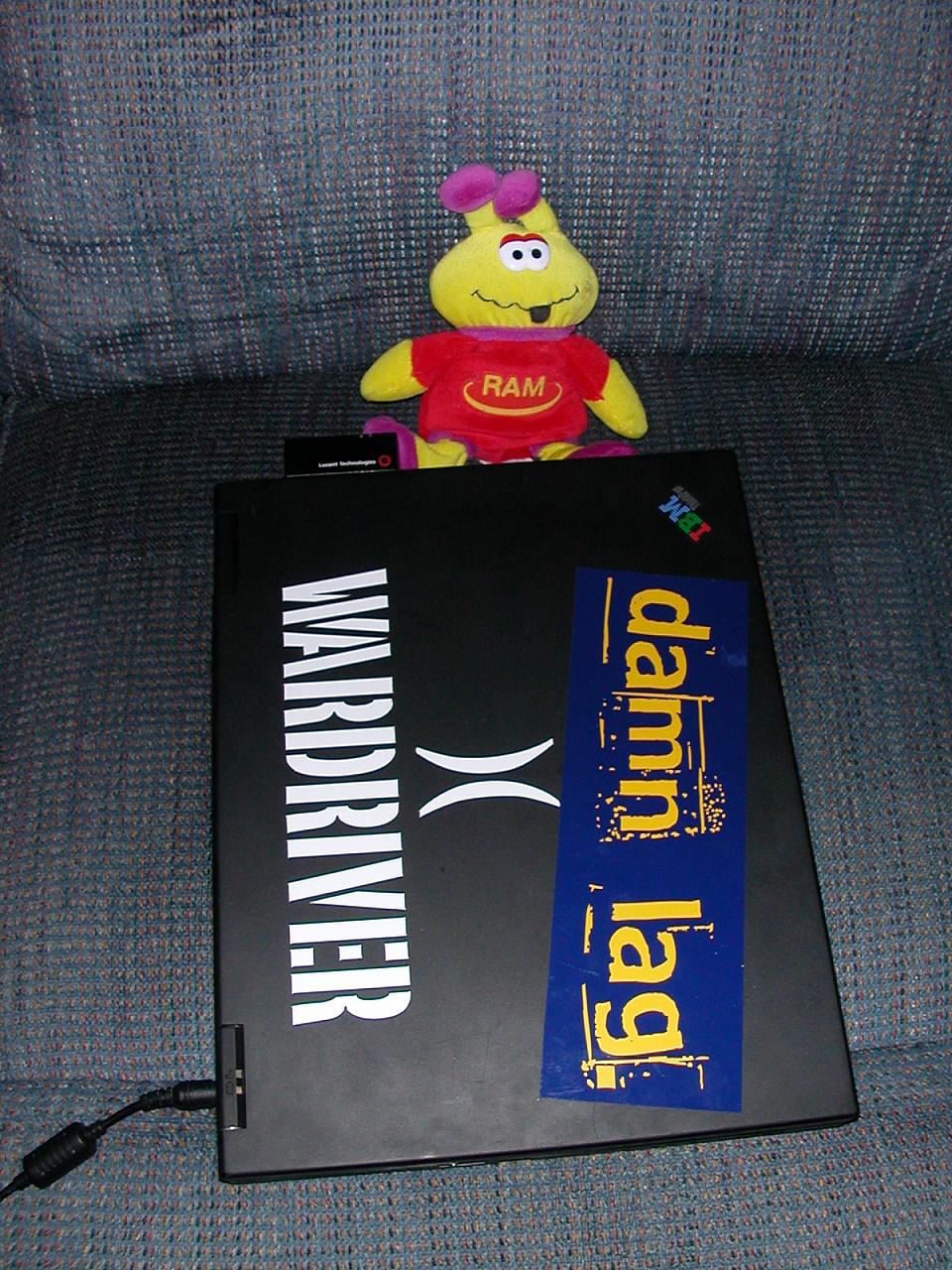 A picture of the lid of the laptop and a stuffed guy thrown in for good measure.