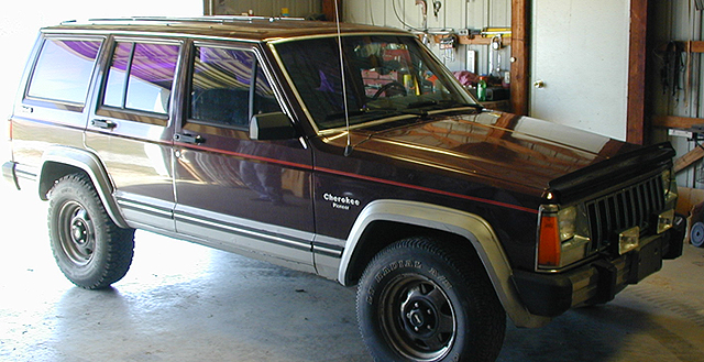 This is my 1987 Jeep Cherokee in the garage of the guy I bought it from.  It looks a little different now.
