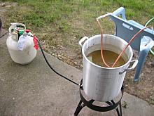 Copper immersion chiller hooked to the garden hose to cool the wort quickly.