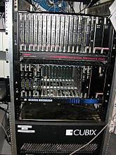 The ISP's main RAS equipment, US Robotics Total Control units.  The telco's cubix server is sitting below them.